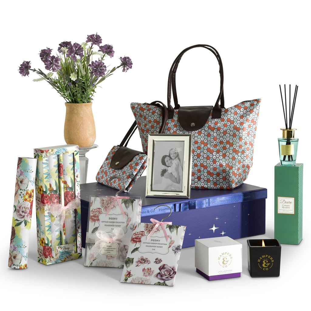 A collection of beautiful things, containing a desire diffuser, drawer hanging sachets, fragrant drawer liners, silver plated photo frame, a floral display and lavender candle presented in a elegant gift box 