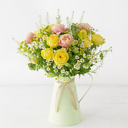 A beautiful flower arrangement bursting with Sunshine Yellows and Warm Oranges. 